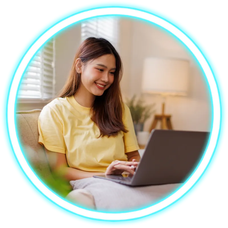 Woman smiling using laptop