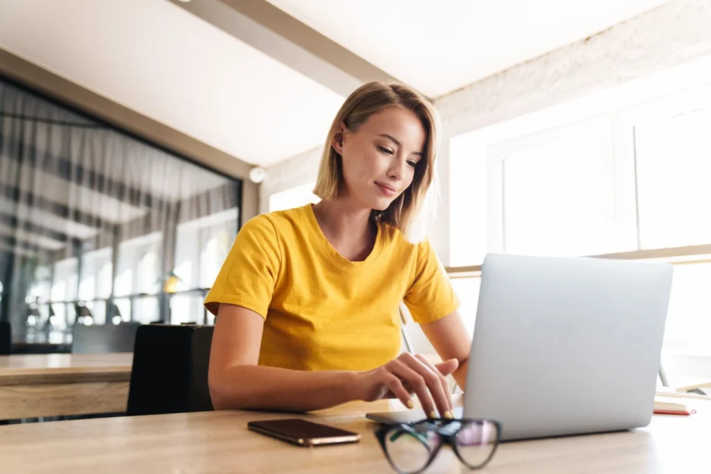 Woman typing on laptop